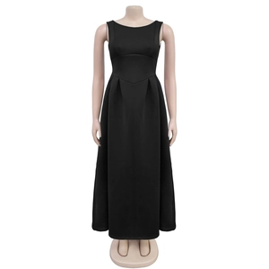 Detail of a black sleeveless maxi dress featuring a V-shaped waist seam and pleated skirt design