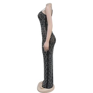 Detail of black mesh dress with intricate silver rhinestone diamond patterns and texture