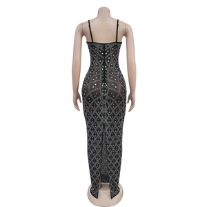 Detail of black rhinestone bodycon dress featuring a rear zipper and back slit design