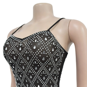 Detail of black mesh mini dress with silver rhinestones and delicate thin straps