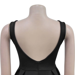 Detail of elegant black backless maxi dress with deep V-cut and invisible zipper closure