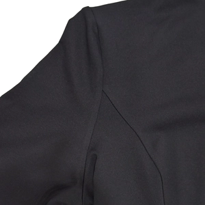 Detailed view of the shoulder seam and high-quality stitching on this black fitted dress