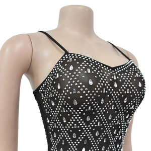 Detailed view of black mesh camisole featuring intricate rhinestones and faux gemstones