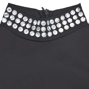 Detail of high neck black dress featuring triple-row rhinestone trim and rear zipper closure