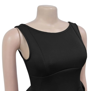 Close-up of black sleeveless dress with elegant round neck and peplum waist detail