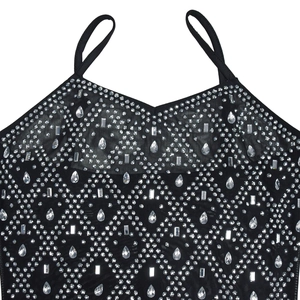 Detail of black mesh camisole with sparkling silver rhinestones in geometric patterns