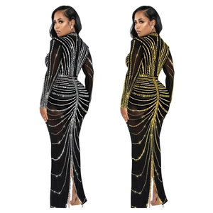 Detail of elegant long sleeve rhinestone dress featuring intricate mesh and sparkling lines