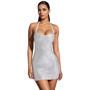 Detail of shimmering silver sequins and halter neck design on a sexy bodycon mini dress