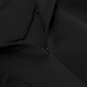 Detailed close-up showing the invisible zipper on high-quality black knit fabric