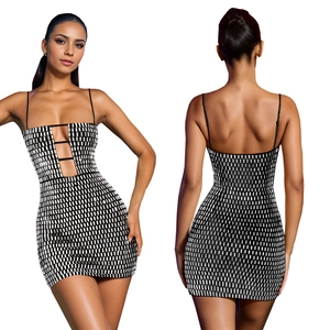 Close-up of black mini dress featuring silver sequins, thin straps, and front cutout details