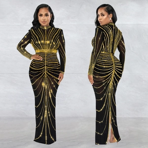 Elegant black mesh dress with long sleeves and gold sequins in a radial pattern