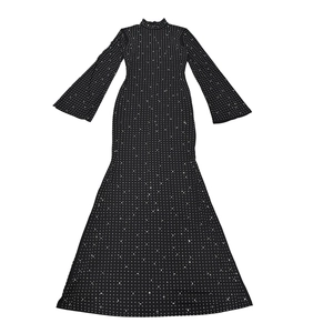 Close-up of sparkling rhinestones and elegant flared sleeves on a black bodycon dress