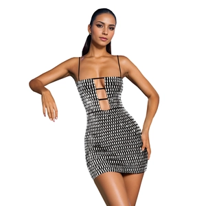 Detailed close-up of shiny black and white sequins on a sexy slim party mini dress