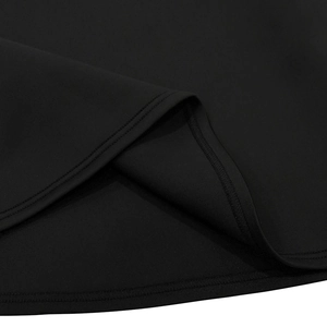 Close-up of black sleeveless dress showing high-quality double-needle stitching and fabric texture