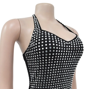 Detail of black halter dress featuring sparkling silver square rhinestone embellishments