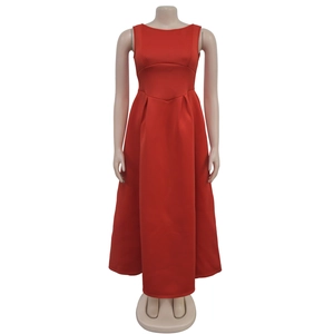 Detailed view of the red sleeveless maxi dress with a pleated waist and high side slit
