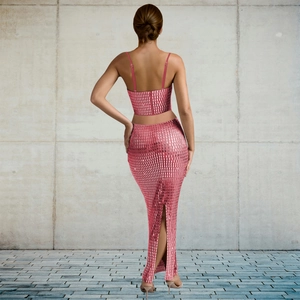 Back view of pink sequined two-piece set featuring cropped camisole and slit maxi skirt