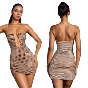 Detailed close-up of champagne bodycon dress with silver mirror sequins and cut-out details