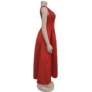 Side view of red sleeveless backless high-waist maxi dress on mannequin stand
