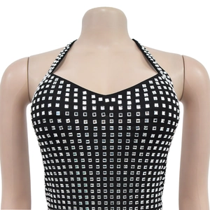 Close-up of black halter dress featuring rows of shimmering square silver rhinestones