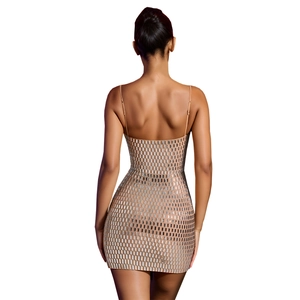 Detail of champagne mini dress with sparkling silver sequins and slender straps