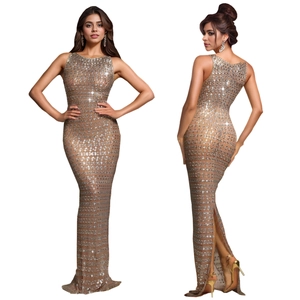 Detail view of bronze sequined evening gown with slim fit cut and elegant back slit