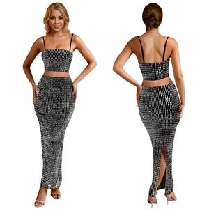 Detail view of two-piece set featuring cropped tank top and side slit maxi skirt in dot print