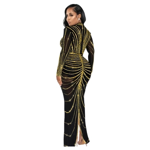 Detailed view of black bodycon dress with gold sequins and elegant back slit design