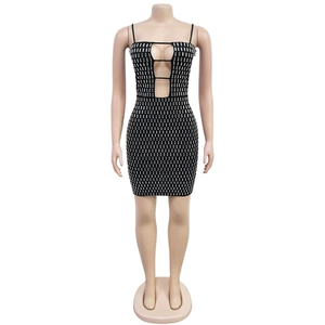 Detail of black bodycon mini dress with side cut-outs and shimmering silver rhinestones