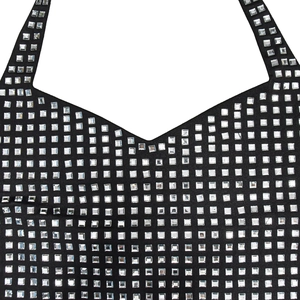 Detail of square silver rhinestones in a grid pattern on a black halter neck dress