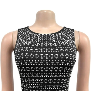 Detailed view of black sleeveless dress with sparkling silver rhinestones on slim-fit fabric