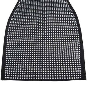 Detailed view of black bodycon dress with silver square rhinestones in grid pattern