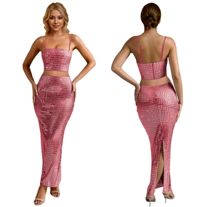 Detail of pink sequin two-piece set featuring crop top and high-waisted slit skirt