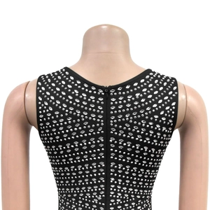 Close-up of the back hidden zipper and silver rhinestone details on black dress