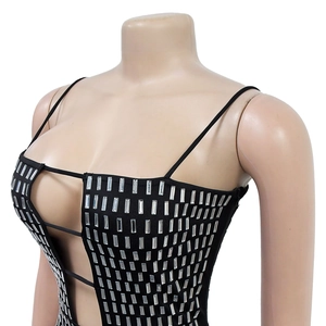 Detail of black party dress with silver rhinestone embellishments and cutout design