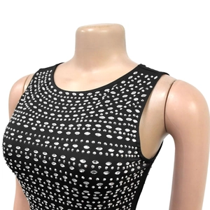 Detailed close-up of a black sleeveless bodycon dress featuring layered silver rhinestones