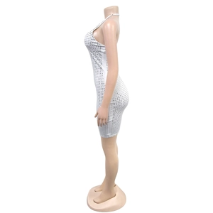 Detail of white bodycon dress featuring silver rhinestone mesh and square pattern texture