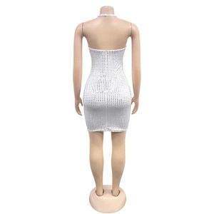 Detail of silver sequin bodycon dress with halter neck and backless design for party wear