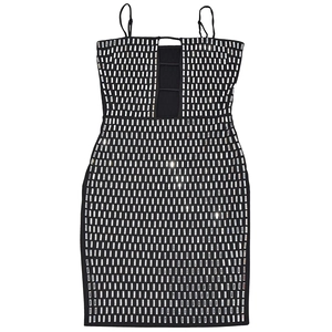 Detail of black mini dress featuring rhinestone grid pattern and cutout straps