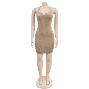 Detail view of shimmering square sequins on champagne bodycon halter mini dress