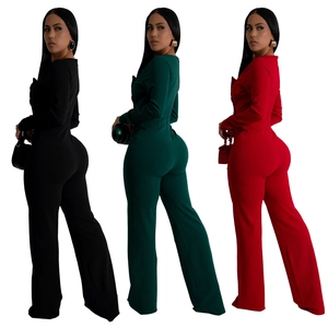 Detail view of long sleeve slim fit jumpsuits in black, dark green, and red colors