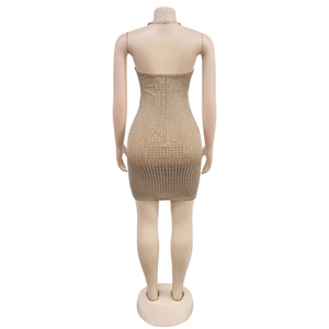 Detailed back view of a beige bodycon mini dress featuring silver square rhinestones
