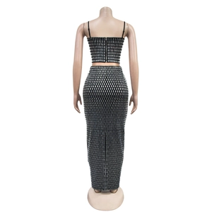 Rear view of black sequin two-piece set featuring a cropped camisole and maxi skirt