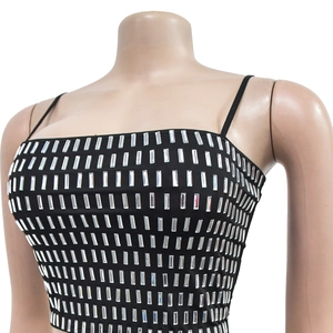 Detail of the black camisole featuring sparkling silver rhinestones in a grid pattern