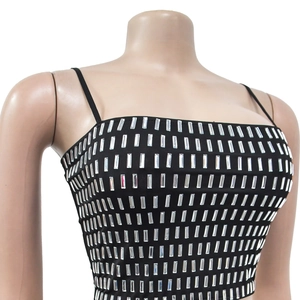 Close-up of black spaghetti strap top with silver rectangular rhinestone embellishments