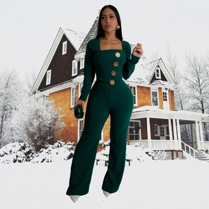 Detail of square neck and vintage gold buttons on dark green long sleeve jumpsuit