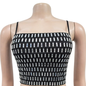 Close-up of sparkling rectangular silver rhinestones on a black cropped camisole top