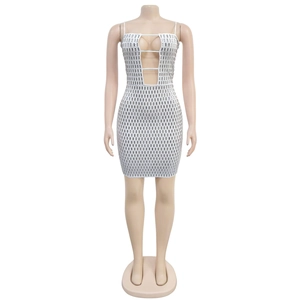 Detail of white bodycon dress with deep V-neck cutout and silver sequin embellishments