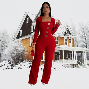 Detail of red square neck jumpsuit with decorative gold buttons and flared leg cut