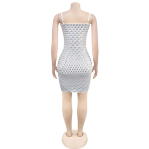 Close-up of white sequin bodycon mini dress with silver rectangular paillettes on back